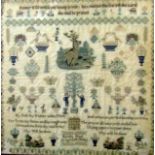 A 19th century needlework sampler by Martha Steele aged 14, dated 1864, with religious text,