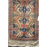 Afghan village rug with various medallions upon a brown ground, 140 x 85 cm