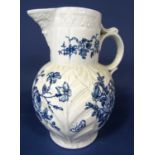 A large 18th century leaf moulded jug in the Worcester manner with blue and white printed flower and