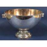 Silver plated novelty punch bowl with twin horse head handles upon a stepped circular base, 40cm