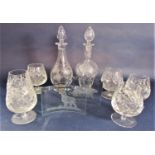 A mixed collection of glassware to include two similar floral etched decanters, 30cm high, a set