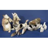 A collection of unusual studio pottery models of horses, two recumbent (one af) two modelled as