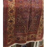 Good quality Bidjar carpet with intricate scrolled foliate decoration upon a dark ground, 370 x