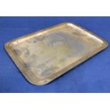 1920s silver card tray of rectangular form engraved with a floral cartouche, maker mark worn,