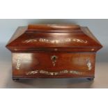 A Regency rosewood and mother of pearl inlaid caddy, the hinged lid enclosing two rosewood lidded