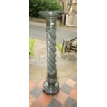 A polished marble column with wrythen twist centre raised on an octagonal base, 105 cm in height
