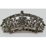 Antique white metal diamond set brooch in the form of a crown or tiara with the central stone .65