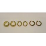 Three pairs of 9ct hoop earrings of various design, 7.3g