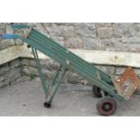 A metal sack truck with folding platform and hard rubber tyres, used/weathered