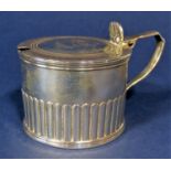 Early Victorian silver half fluted mustard, the hinged lid with engraved crest of two rampant