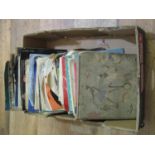 A box containing a collection of mixed 45rpm records various dates and genres (1)