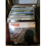 A large collection of mixed vinyl LPs and 45 rpm singles, mostly 1980s pop and rock music but