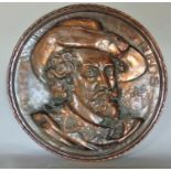Embossed copper circular plaque decorated with the bust of a cavalier inscribed Petrus Palus Rubens,