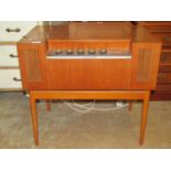 A mid 20th century HMV floorstanding record player model 2010 serial number duplicate 5558, the teak