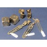 A collection of novelty silver items to include a pair of dice, pair of miniature cherubs and