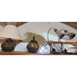 A pair of Indian planished ovoid table lamps, together with a further pair of reading lamps with