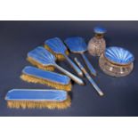 A collection of silver and guilloche enamel dressing set items comprising four brushes, a mirror,