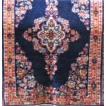 Mahal rug with central floral decoration upon a navy blue ground, 205 x 140 cm