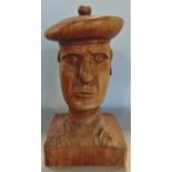 A carved treen bust of a Scots guard, 37cm high