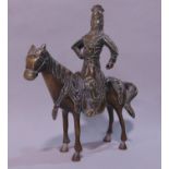 Japanese bronze figural study of a Samurai type warrior on horseback, fitted with various