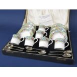 A boxed set of Royal Worcester Martley pattern coffeewares comprising six coffee cans and six