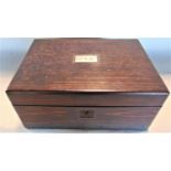 A good quality 19th century coromandel sewing or jewellery box, the hinged lid enclosing a