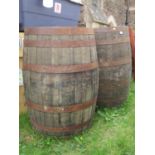 A paid of coopered oak and steel banded bourbon whiskey approx 60cm diameter x 90cm high