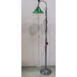 Vintage style floorstanding adjustable reading light with a dull brass finish with green glass shade