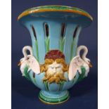 A late 19th century Minton majolica two handled vase with turquoise ground moulded swan handles