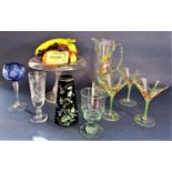 A large collection of glassware comprising a novelty glass cocktail jug and three martini glasses