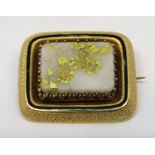 Unusual Etruscan style rectangular yellow metal brooch, set with a polished white hardstone plaque