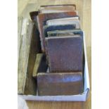 A box containing a number of small leather bound antiquarian and other books including Gunters Line,