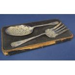 Cased silver serving fork and spoon set with scrolled foliate engraved bowls and shanks, maker A & D