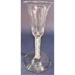 Good quality bell shaped wine glass with latticino stem, broad foot and rough pontil mark, 16cm high