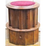 A Victorian mahogany commode of circular form with fluted panels, rising lid, ceramic chamber and