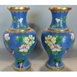 Pair of cloisonné baluster vases, decorated with lotus flower and birds upon a blue ground, 27cm