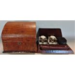 A good quality snakeskin leather desk set to include a twin glass standish with silver tops and