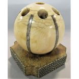A good quality antique ivory and silver applied spherical pen holder upon a shagreen square shaped