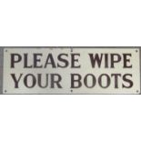 An small enamel sign of rectangular form with cream ground, brown lettering - Please Wipe Your