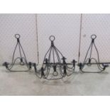 An iron work six branch chandelier with candle sconces, together with a pair of matching two