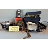 A large quantity of vintage camera and optical equipment to include a vintage Zenit-B camera with