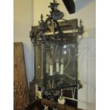 A heavy cast bronze framed country house size hanging porch lantern with acanthus leaf, scroll and