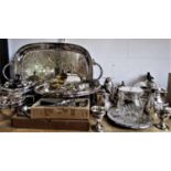 A collection of silver plated items to include a three piece boat shaped half fluted tea service,