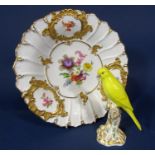 19th century continental dish in the Meissen manner with painted floral sprays and reserved gilt