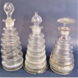 Three unusual novelty ribbed tapered decanters, the largest 24cm high (two af)