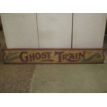 A hand painted wooden fairground sign, Dare You To Ride The Ghost Train, 166cm x 27cm