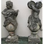A pair of large reclaimed putti musicians, one playing the lute the other cymbals, classically