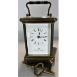 Matthew Norman of London brass cased carriage clock, 12cm high, key and papers