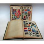 Two stamp albums containing a quantity of British and Worldwide stamps dating from the early 20th