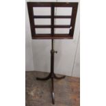 A Regency style mahogany sheet music stand with adjustable frame, the fluted column set on a swept